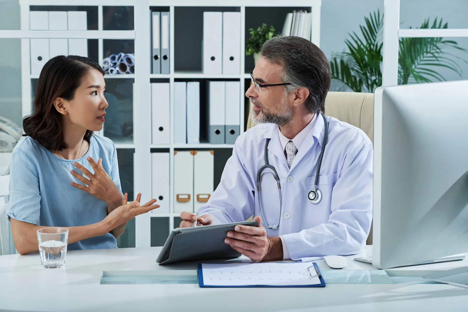 Doctor consulting with patient